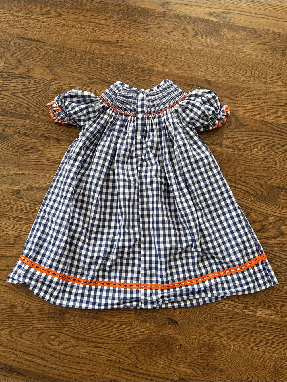 Cecil And Lou Navy Gingham Smocked Dress with Smocked Orange Pumpkin Embroidery